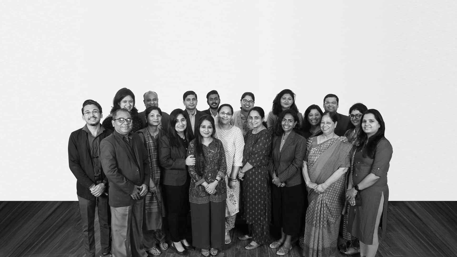 A diverse group of individuals smiling and posing for a photo.