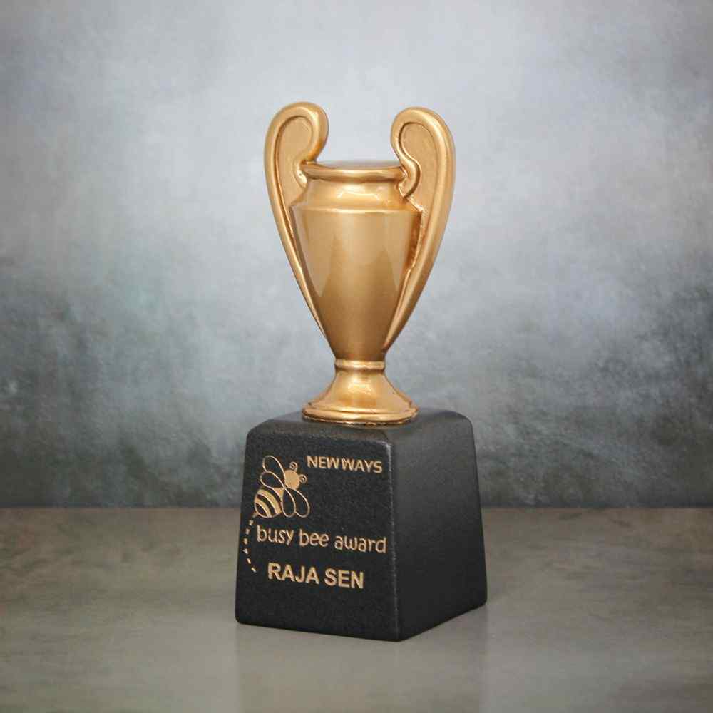 A golden small trophy with black base.