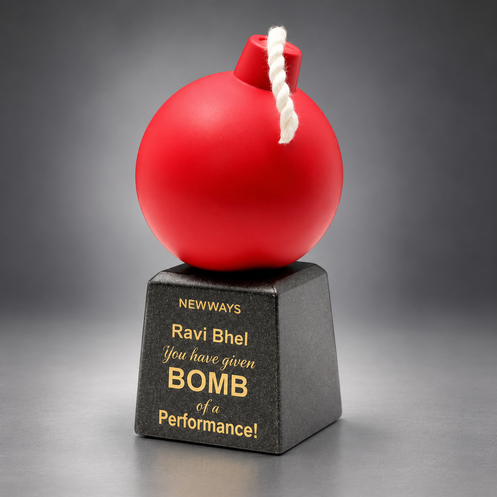 Red bomb shaped resin award with a white rope fuse on a personalised black base fun award at work