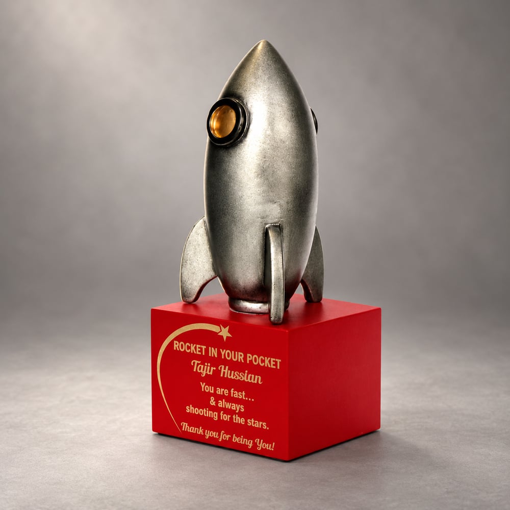 Antique Silver rocket shaped resin fun award with an orange window on a red personalised base