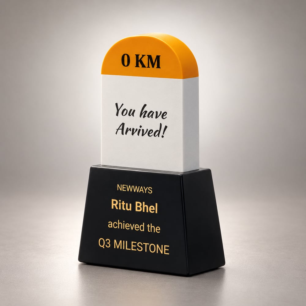 Milestone shaped resin fun award at work with an orange top