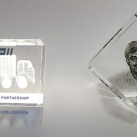 A 3D engraved crystal block featuring a picture of a man and a truck